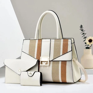 Detailed set of three beige PU leather bags including tote and envelope clutch bags