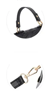 Detail of golden metal hooks and hardware on black quilted leather shell bag