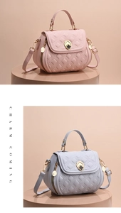 Close-up of quilted pattern details and clover metal clasp on pink and blue bags