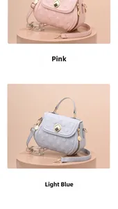 Detail of shell-shaped quilted shoulder bags in pink and light blue with flower lock