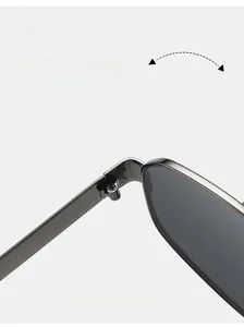 Macro view of durable metal hinge on vintage oversized aviator sunglasses with dark lenses