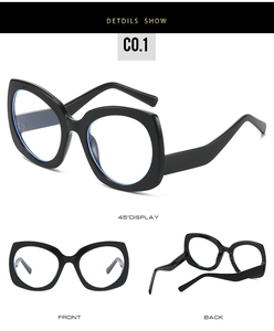 Detailed views of vintage cat eye sunglasses with glossy black frames and clear lenses