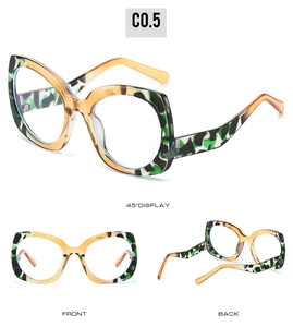 Three perspectives of retro green tortoiseshell cat eye sunglasses with amber temples