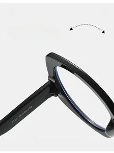 Macro view of the durable metal hinge and rivet details on stylish black cat-eye sunglasses