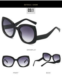 Vistas detalladas frontal y lateral de gafas de sol mariposa negras con lentes degradadas violeta