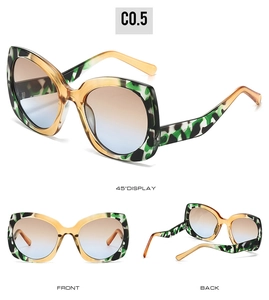 Vistas detalladas de gafas de sol de mariposa con montura bicolor y lentes con degradado