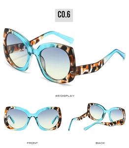 Tres vistas de gafas de sol cat-eye con montura azul y carey y lentes con degradado