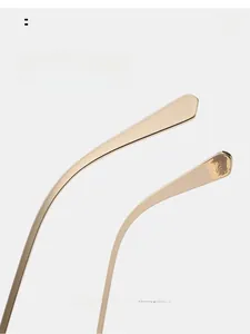 Close-up of curved golden metal temples for sunglasses ensuring comfortable wearing