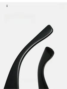 Detail view of ergonomic curved glossy black resin glasses legs for comfortable wear