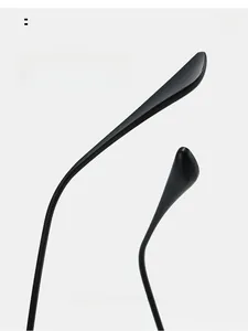 Macro view of matte black curved sunglasses legs showing ergonomic comfortable arc design