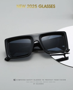 Detail view of stylish thick-frame sunglasses on a reflective tray with NEW 2025 branding