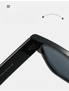 Macro detail of high-durability metal hinges on black oversized eyewear frames