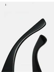 Close-up of glossy black curved sunglass arms designed for ergonomic comfortable wear