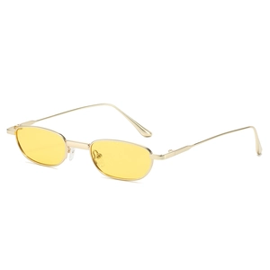 Retro oval sunglasses with yellow lenses and minimalist gold metal frame on white background