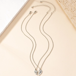 Silver mother daughter matching heart pendant necklaces with engraved lettering