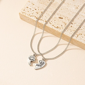 Silver mother daughter heart necklace set with engraved split pendants on stone
