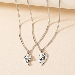 Close-up of split heart pendant necklace set with Mother and Daughter engravings