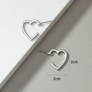 Detail showing dimensions of silver heart stud earrings on high-quality display
