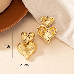 Textured gold double heart earrings with irregular molten lava surface effect