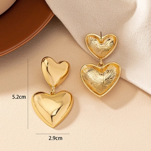 Bohemian gold double heart drop earrings with high polish finish and 5.2cm length