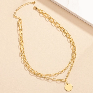 Double layer gold chain necklace with round pendant in industrial minimalist style