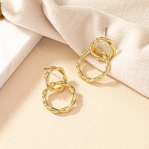 Minimalist golden twisted interlocking circle earrings with textured rope design
