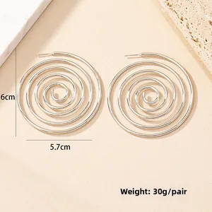 Detailed size view of silver spiral hoop earrings measuring 6cm by 5.7cm on a stone base