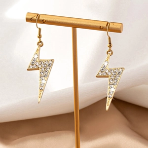 Boucles d'oreilles éclair dorées avec pavé de cristaux sur support en T
