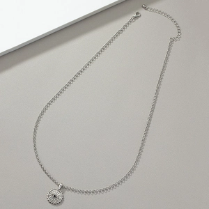 Men's silver punk hip-hop evil eye pendant necklace on a minimalist gray background