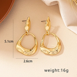Irregular chunky gold geometric earrings with lava texture, dimensions 5.1cm by 2.6cm