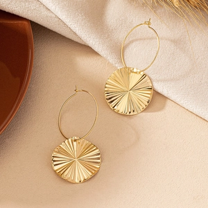 Golden sunburst textured round earrings with elegant hoop dangles for women