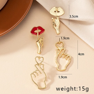 Four-piece gold earring set featuring trendy red lips and hand gesture heart designs