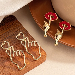 Fashion heart gesture and red lip hand gesture earrings with elegant gold finish