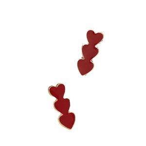 Elegant gold-trimmed triple red heart drop earrings with a glossy enamel finish for women