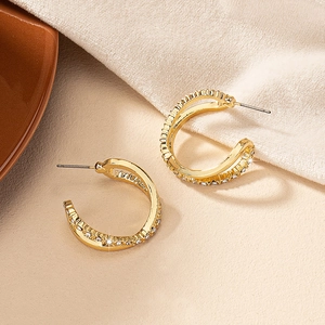 Elegant gold C-shaped double hoop earrings with pavé crystals in a luxury modern style