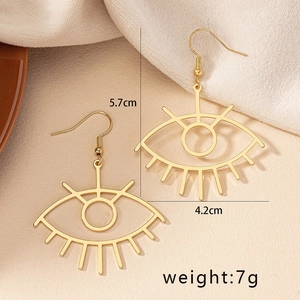 Gold hollow eye drop earrings with eyelash detail and dimensions 5.7cm by 4.2cm