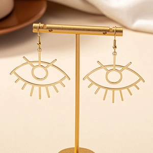 Fashionable golden hollow eye drop earrings with radiating eyelash details for women