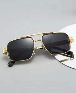 Detailed view of 2025 pilot sunglasses with gold engraved metal frames and dark lenses