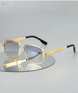 Detailed close-up of golden aviator frame with intricate textured temples and blue lens