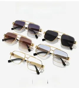 Detail of engraved metal temples on pilot sunglasses with diverse gradient lenses