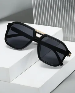 Detail of hex geometric glasses with black frame and golden double bridge bridge