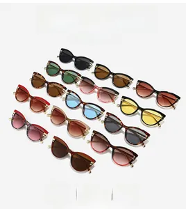 Detailed grid view of stylish cat-eye sunglasses with golden metal side accents and multiple colors