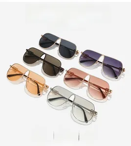 Detailed view of oversized shield sunglasses in six colors with gold heart-shaped temple joints