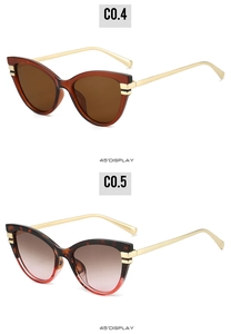 Detailed 45-degree view of cat-eye sunglasses with tortoiseshell frames and metal temples