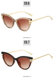Detailed 45-degree view of cat-eye sunglasses with tortoiseshell frames and gold temples