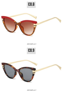 Detailed 45-degree view of cat-eye sunglasses with tortoise frames and golden metal temples
