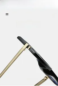 Detail view of premium gold metal hinges and black temples for anti-blue light glasses