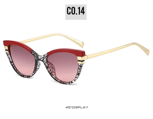 Cat eye sunglasses detail with red frame, net pattern bottom and gold metal temples