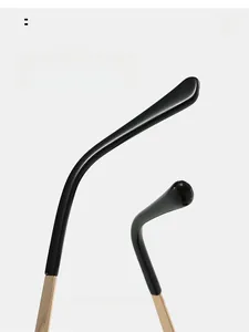 Detail of curved ergonomic temple tips on high-quality black oversized sunglasses