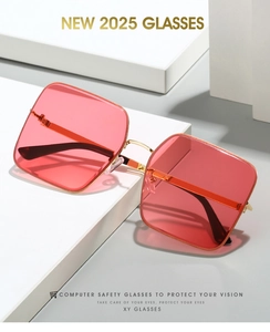 Detailed close-up of square metal frame glasses with pink lenses and gold temples